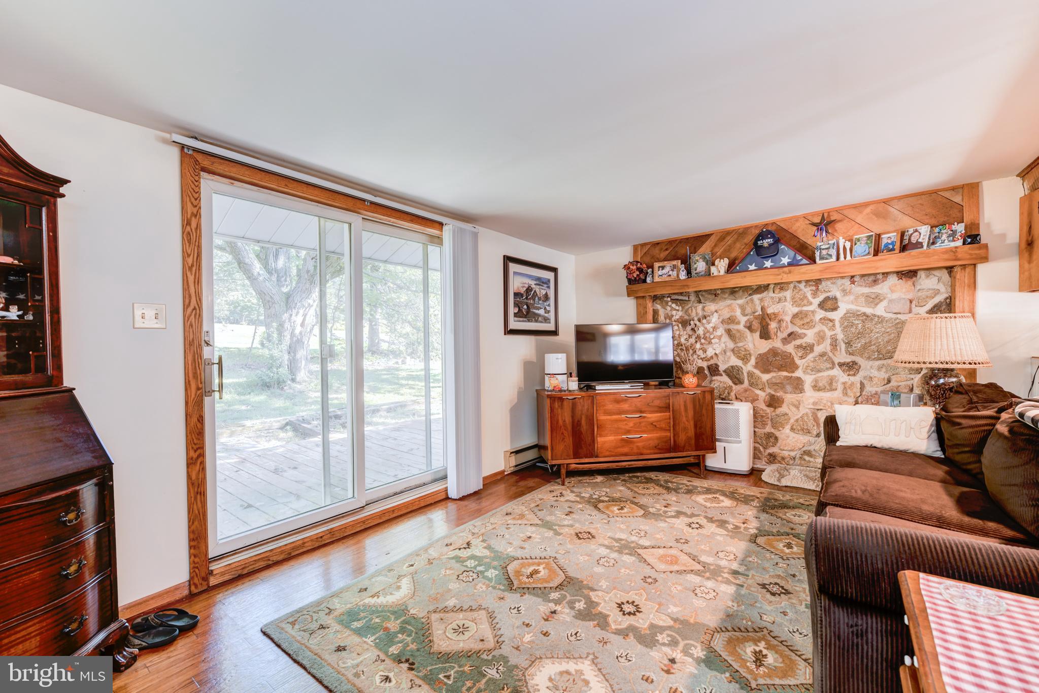 2476 Hopewell Road Elverson, PA 19520 - Photo 31 of 47 Apartment Living Room w. Stone accent wall