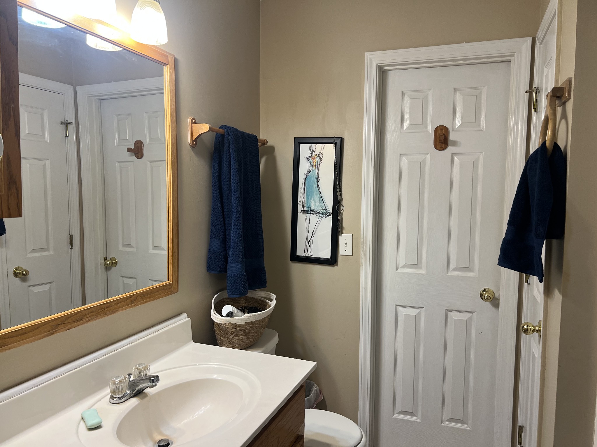 251 Walton Chapel Road Lafayette, TN 37083 - Photo 8 of 16 a bathroom with a sink and mirror with toilet