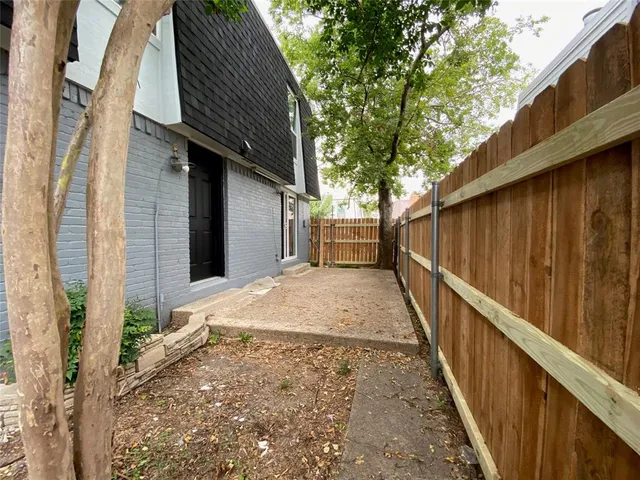 a house view with a backyard space