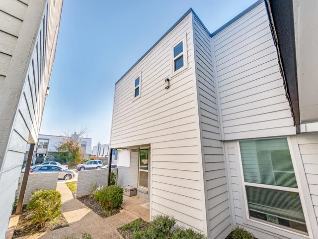a view of a patio with couches chairs and potted plants