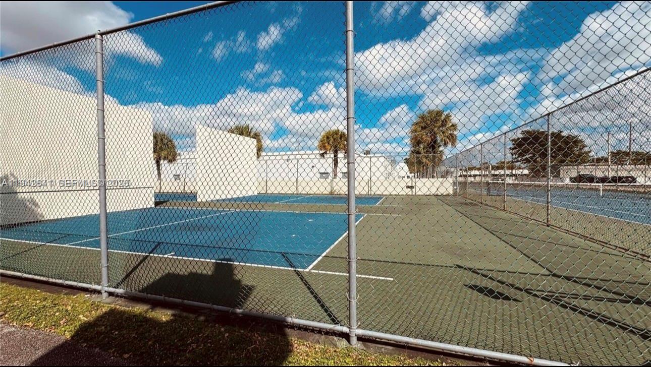 7226 Southwest 94th Place, Unit F7 Miami, FL 33173 - Photo 13 of 17 a view of a tennis court