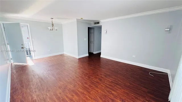 a view of a livingroom with wooden floor