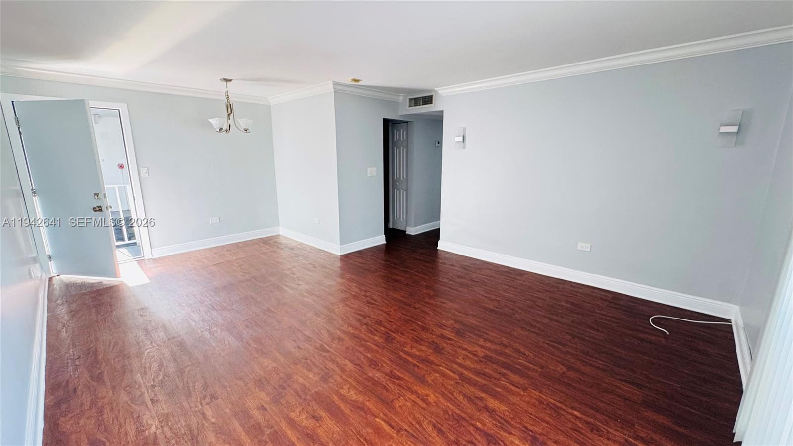 7226 Southwest 94th Place, Unit F7 Miami, FL 33173 - Photo 2 of 17 a view of a livingroom with wooden floor