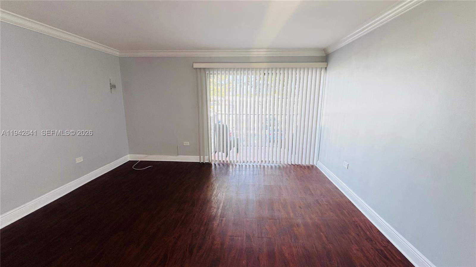 7226 Southwest 94th Place, Unit F7 Miami, FL 33173 - Photo 8 of 17 wooden floor in an empty room