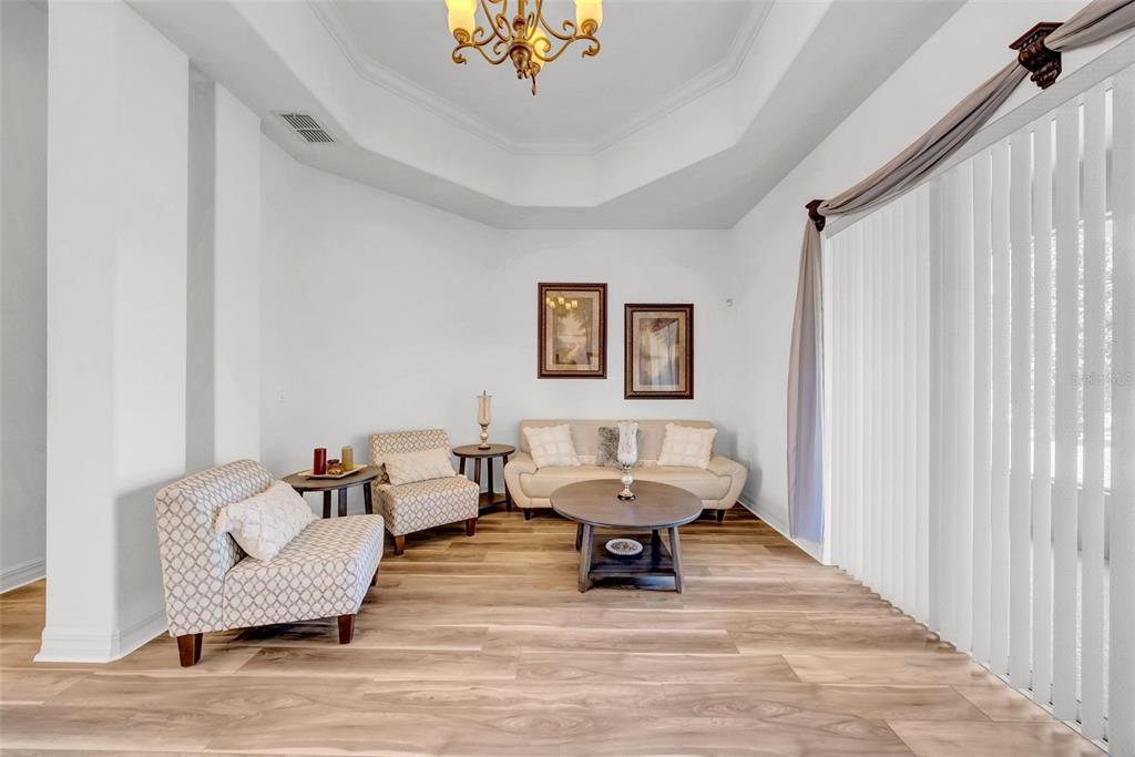 10177 Deer Street Spring Hill, FL 34608 - Photo 15 of 73 a living room with furniture and a wooden floor