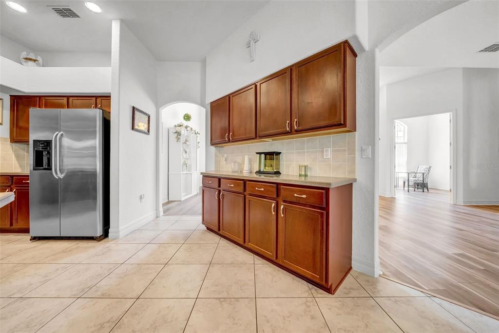 10177 Deer Street Spring Hill, FL 34608 - Photo 20 of 73 a kitchen with stainless steel appliances granite countertop a refrigerator and a stove top oven