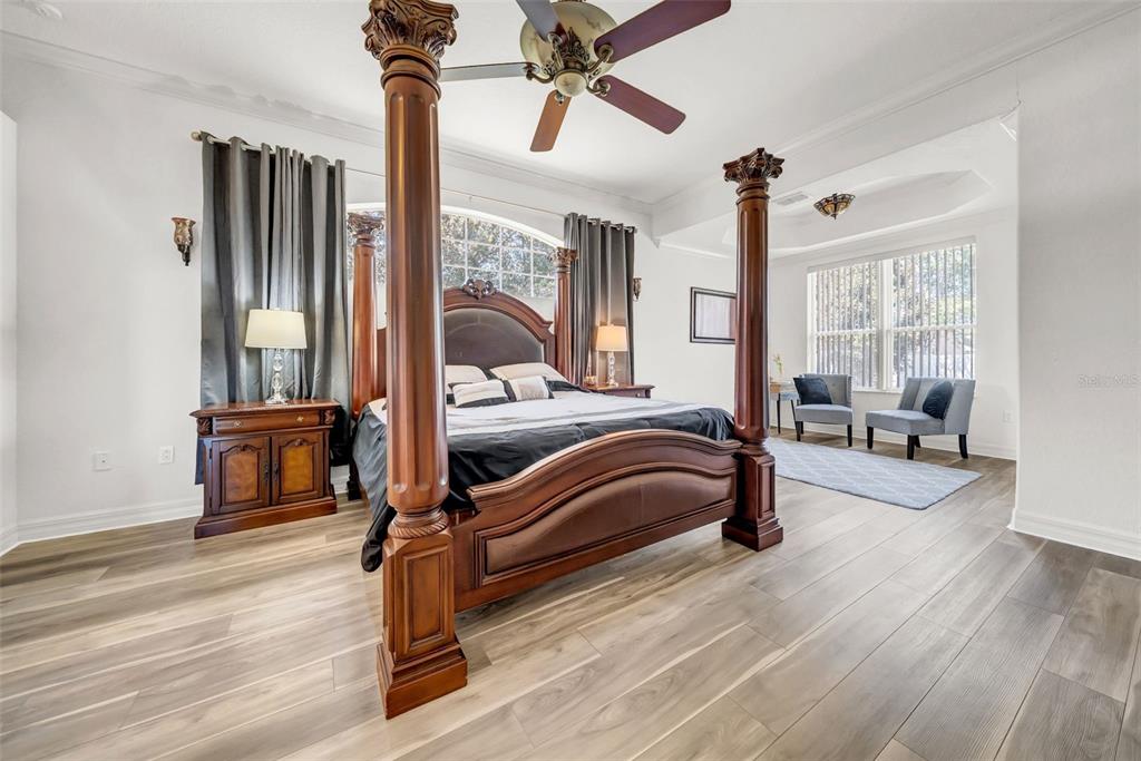 10177 Deer Street Spring Hill, FL 34608 - Photo 32 of 73 a bedroom with a bed wooden floor and window