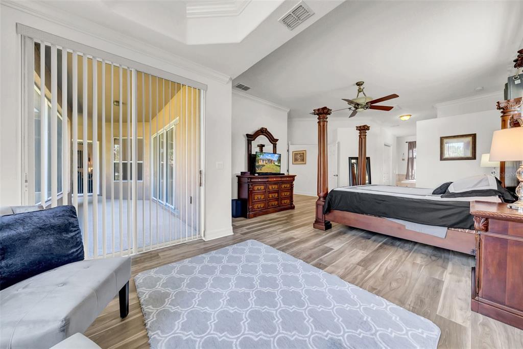 10177 Deer Street Spring Hill, FL 34608 - Photo 36 of 73 a bedroom with furniture and a wooden floor