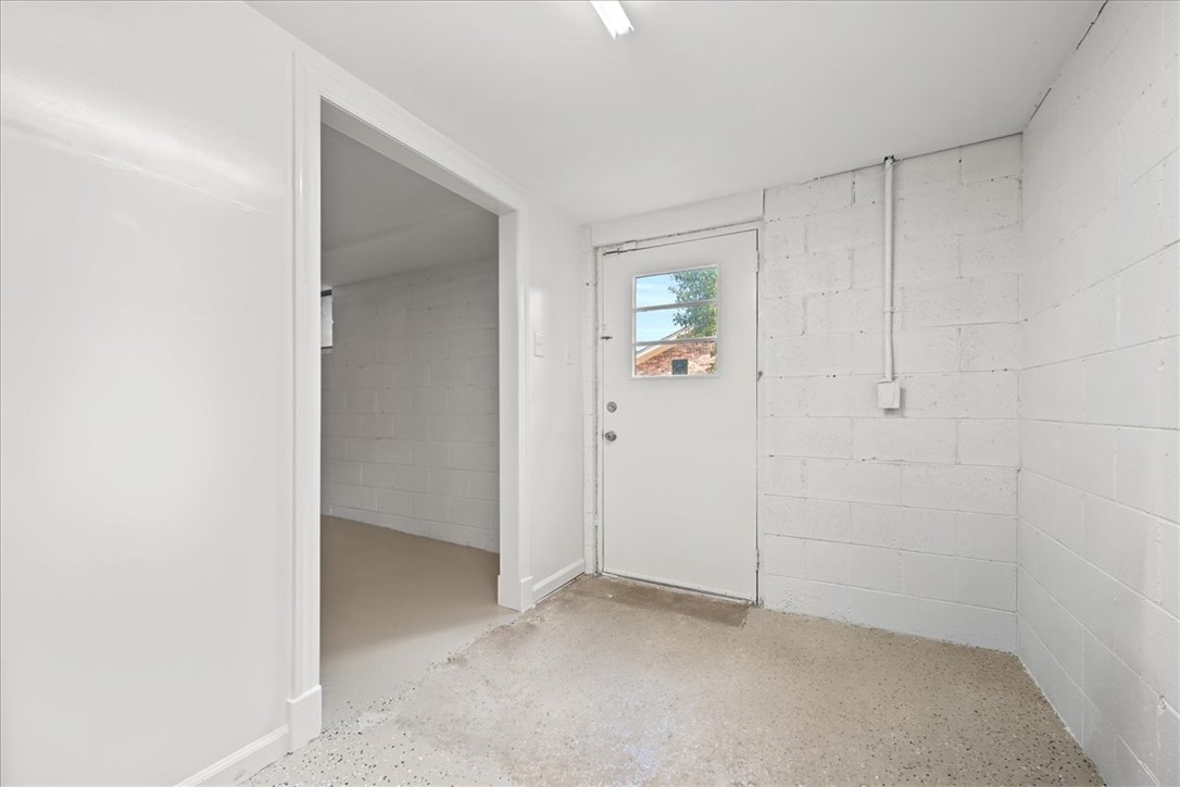 16 State Rd S-23-429 Greenville, SC 29609 - Photo 26 of 34 Concrete floors and solid block walls define this functional utility space.