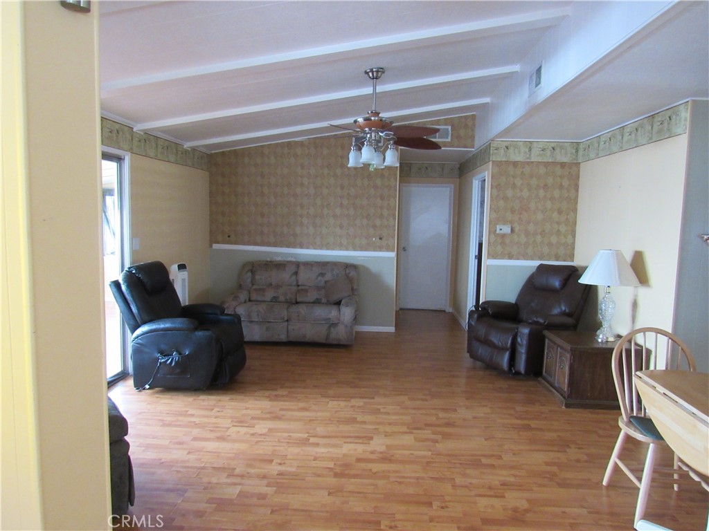 27701 Murrieta Road, Unit 6 Menifee, CA 92586 - Photo 8 of 28 a living room with furniture and a ceiling fan