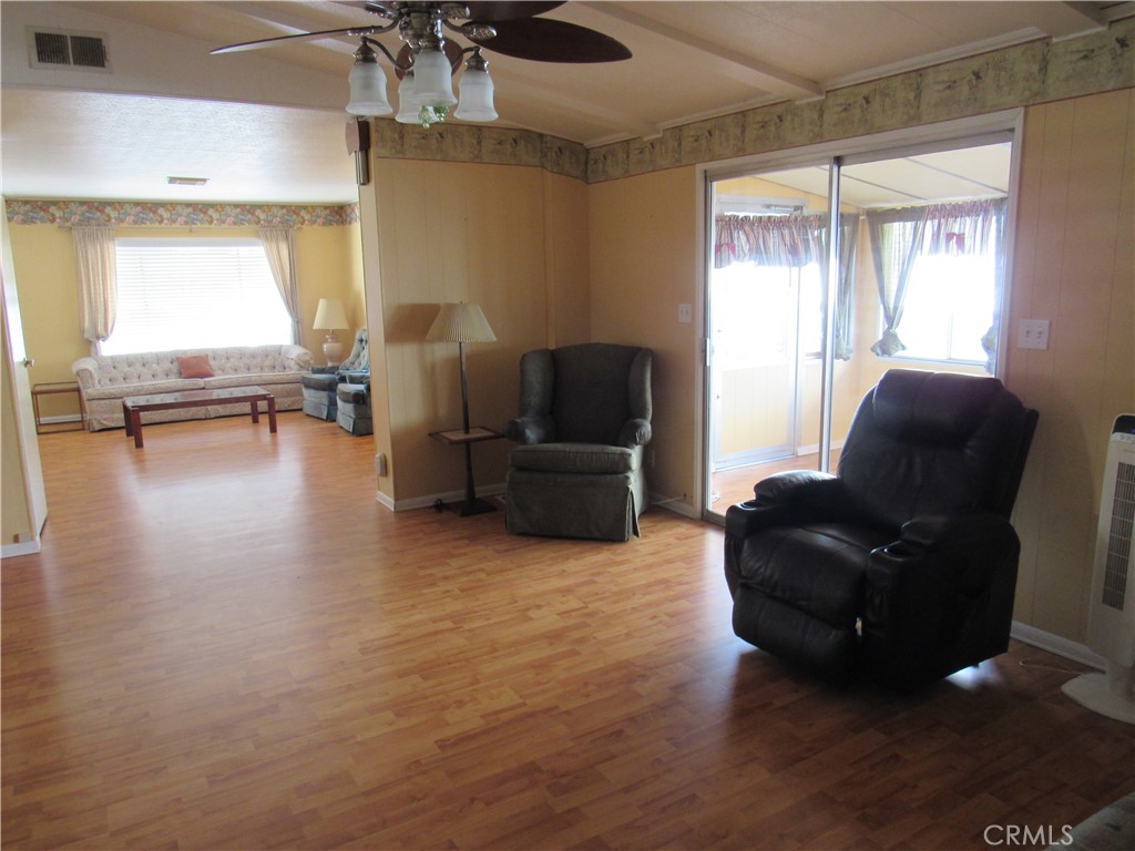 27701 Murrieta Road, Unit 6 Menifee, CA 92586 - Photo 10 of 28 a living room with furniture and a large window