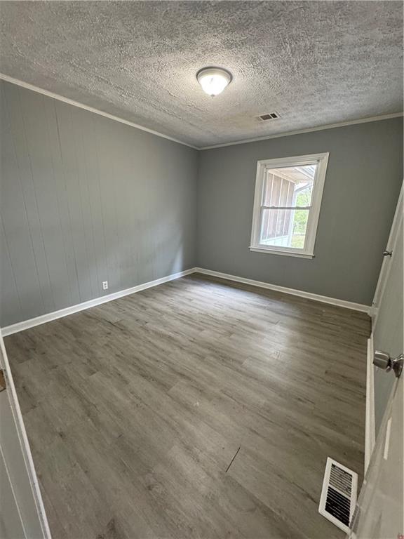26 Plainview Drive Southwest Cartersville, GA 30120 - Photo 11 of 18 an empty room with windows