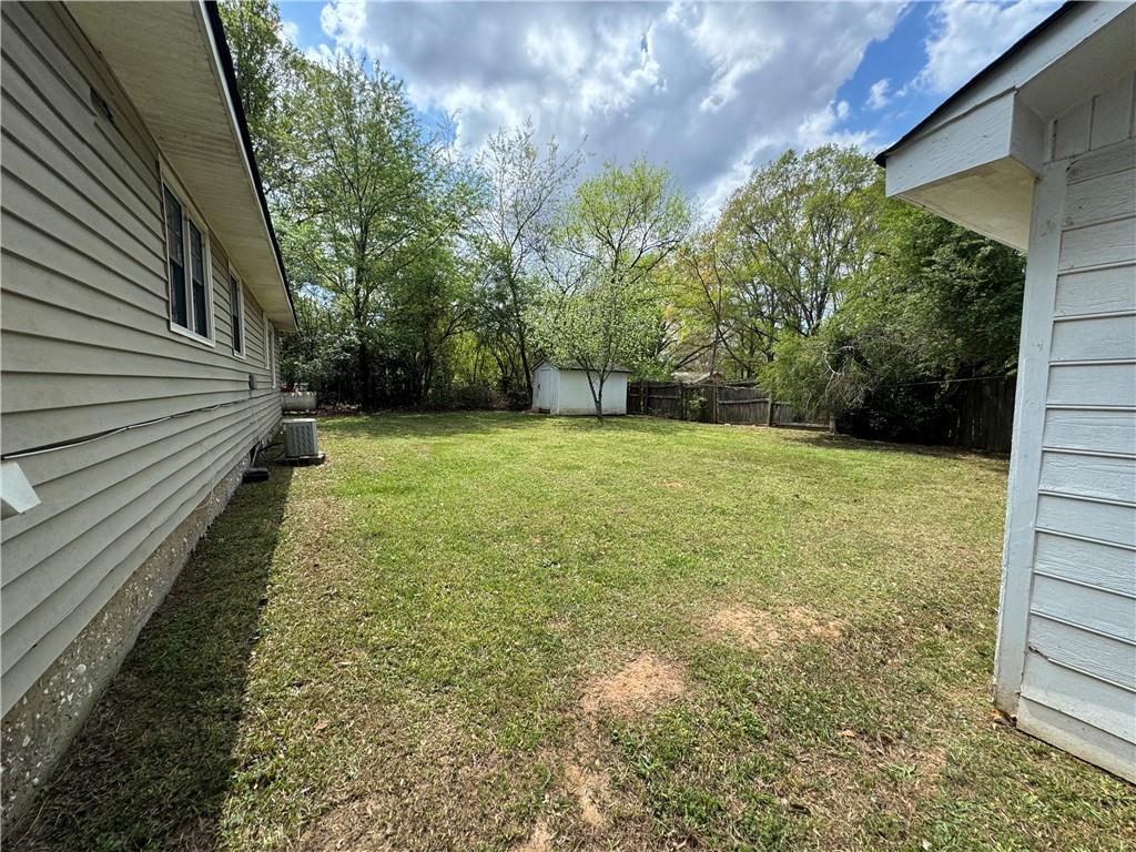 26 Plainview Drive Southwest Cartersville, GA 30120 - Photo 13 of 18 a view of a garden with a bench