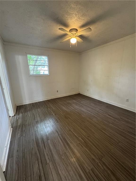 26 Plainview Drive Southwest Cartersville, GA 30120 - Photo 17 of 18 an empty room with wooden floor and windows
