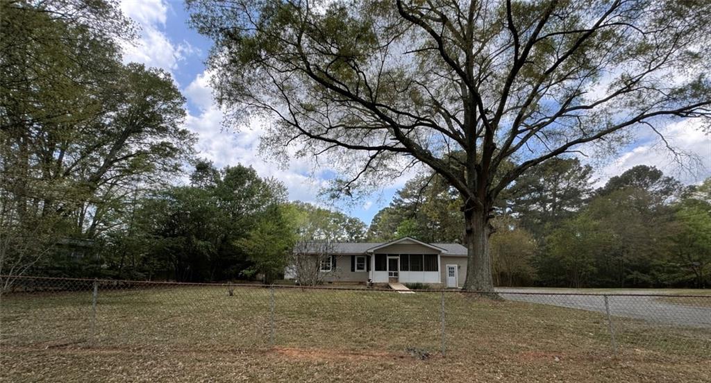 26 Plainview Drive Southwest Cartersville, GA 30120 - Photo 2 of 18 a front view of a house with a garden