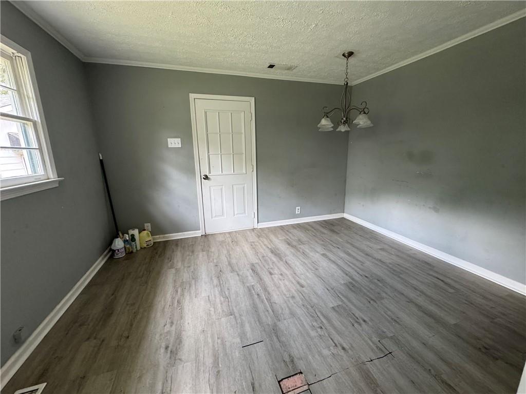 26 Plainview Drive Southwest Cartersville, GA 30120 - Photo 5 of 18 wooden floor in an empty room with a window