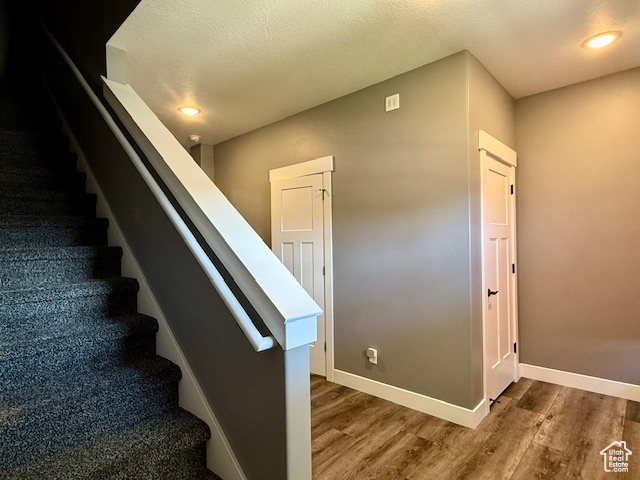 718 700 East Preston, ID 83263 - Photo 37 of 45 Staircase with wood finished floors and recessed lighting
