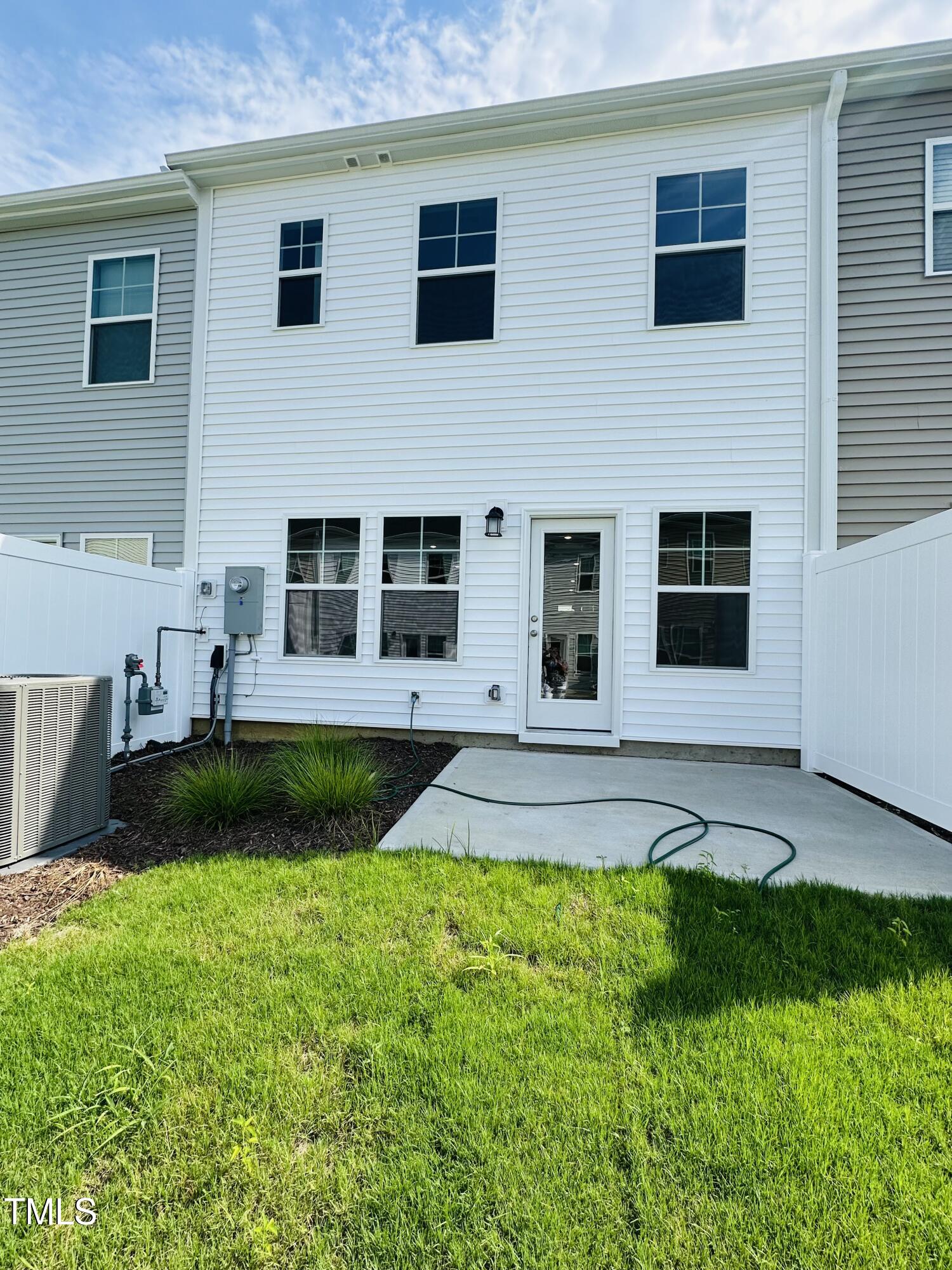 231 Paramount Drive Smithfield, NC 27577 - Photo 6 of 9 a view of a house with swimming pool and sitting area