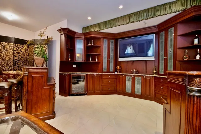 a kitchen with stainless steel appliances a refrigerator and a stove top oven