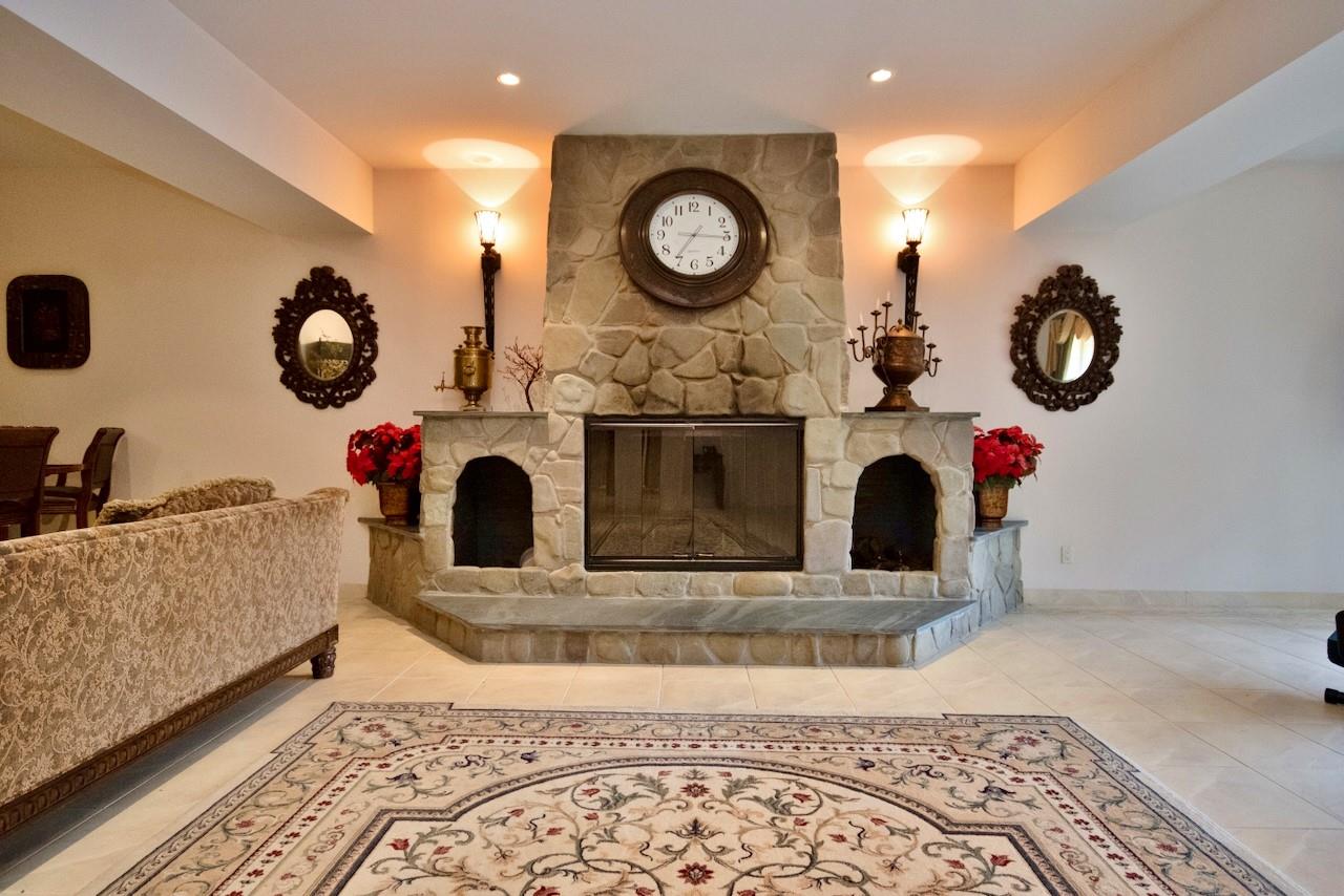 935 Starlight Road Monticello, NY 12701 - Photo 12 of 50 a living room with furniture and a fireplace
