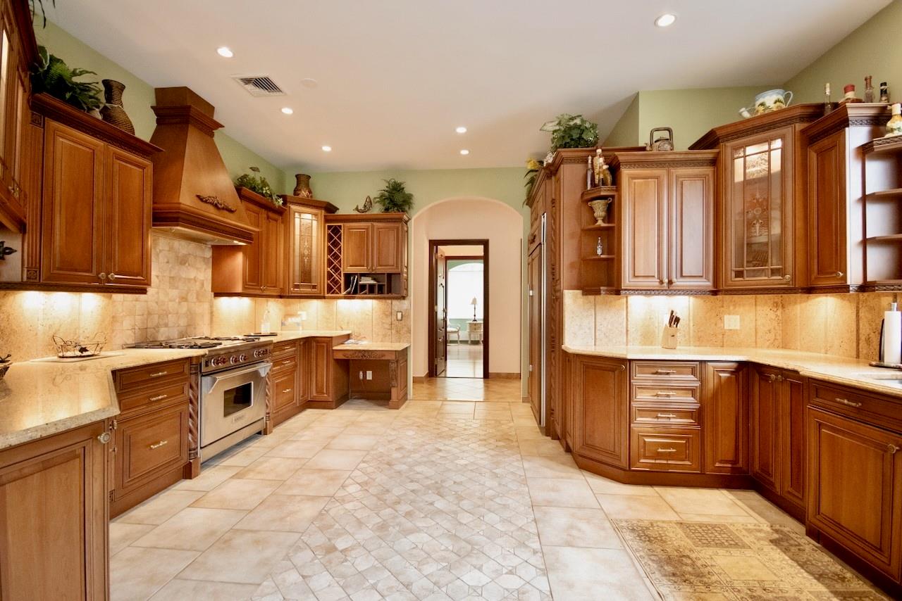 935 Starlight Road Monticello, NY 12701 - Photo 16 of 50 a large kitchen with stainless steel appliances lots of counter space and wooden cabinets