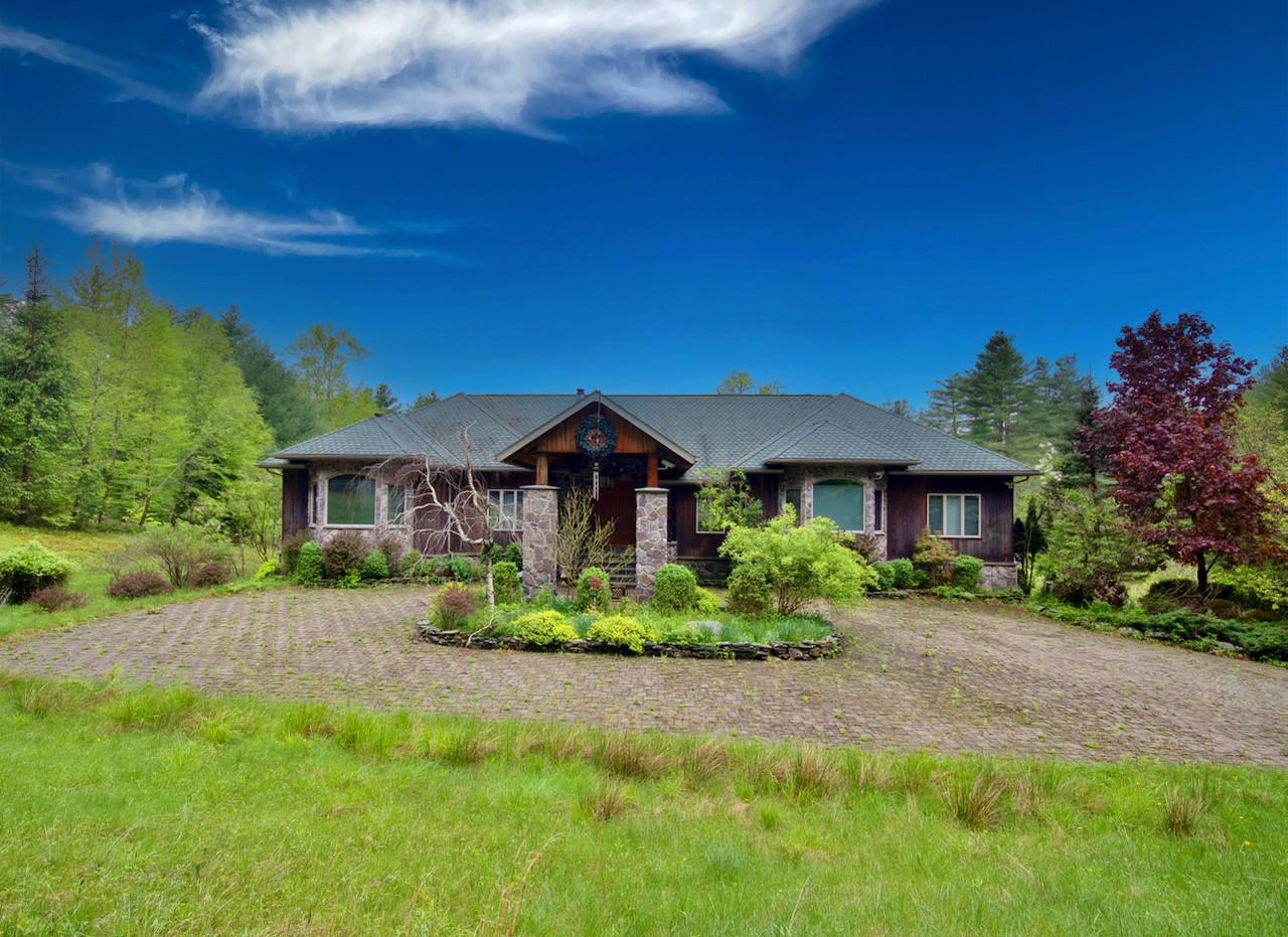 935 Starlight Road Monticello, NY 12701 - Photo 3 of 50 a front view of a house with a yard