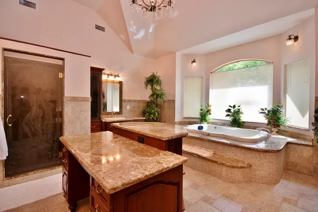 a view of living room with furniture and a chandelier
