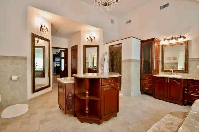 a bath tub sitting in a bathroom next to a window