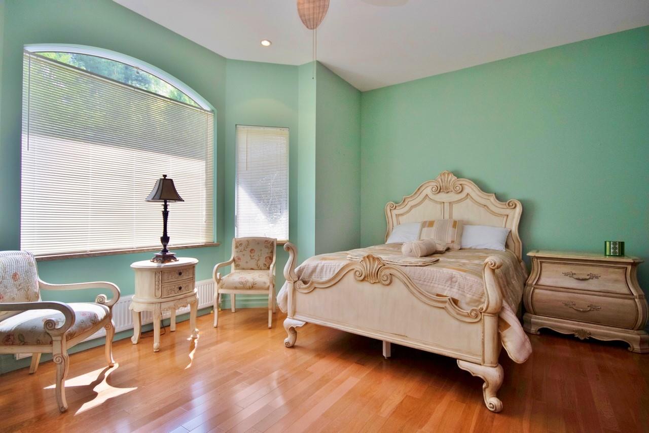 935 Starlight Road Monticello, NY 12701 - Photo 35 of 50 a bedroom with a bed and wooden floor