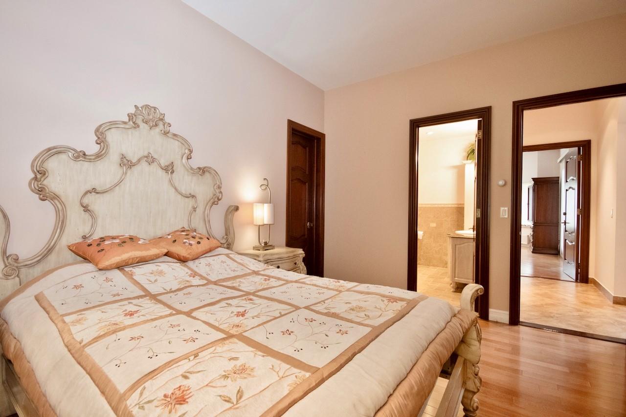 935 Starlight Road Monticello, NY 12701 - Photo 39 of 50 a bedroom with a large bed and a chandelier