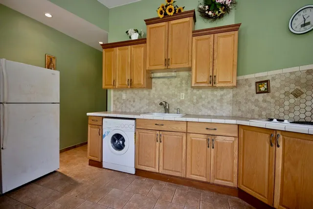 a view of a livingroom with furniture and windows