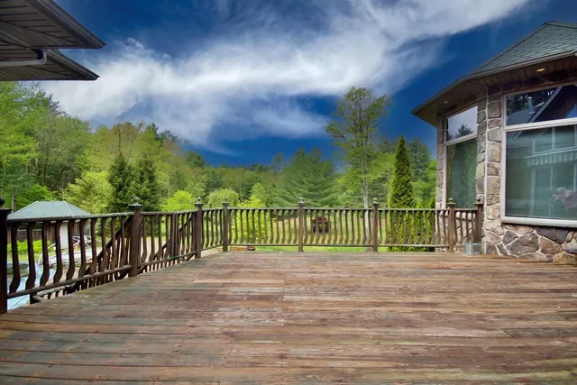 a kitchen with stainless steel appliances granite countertop a refrigerator a stove and a sink