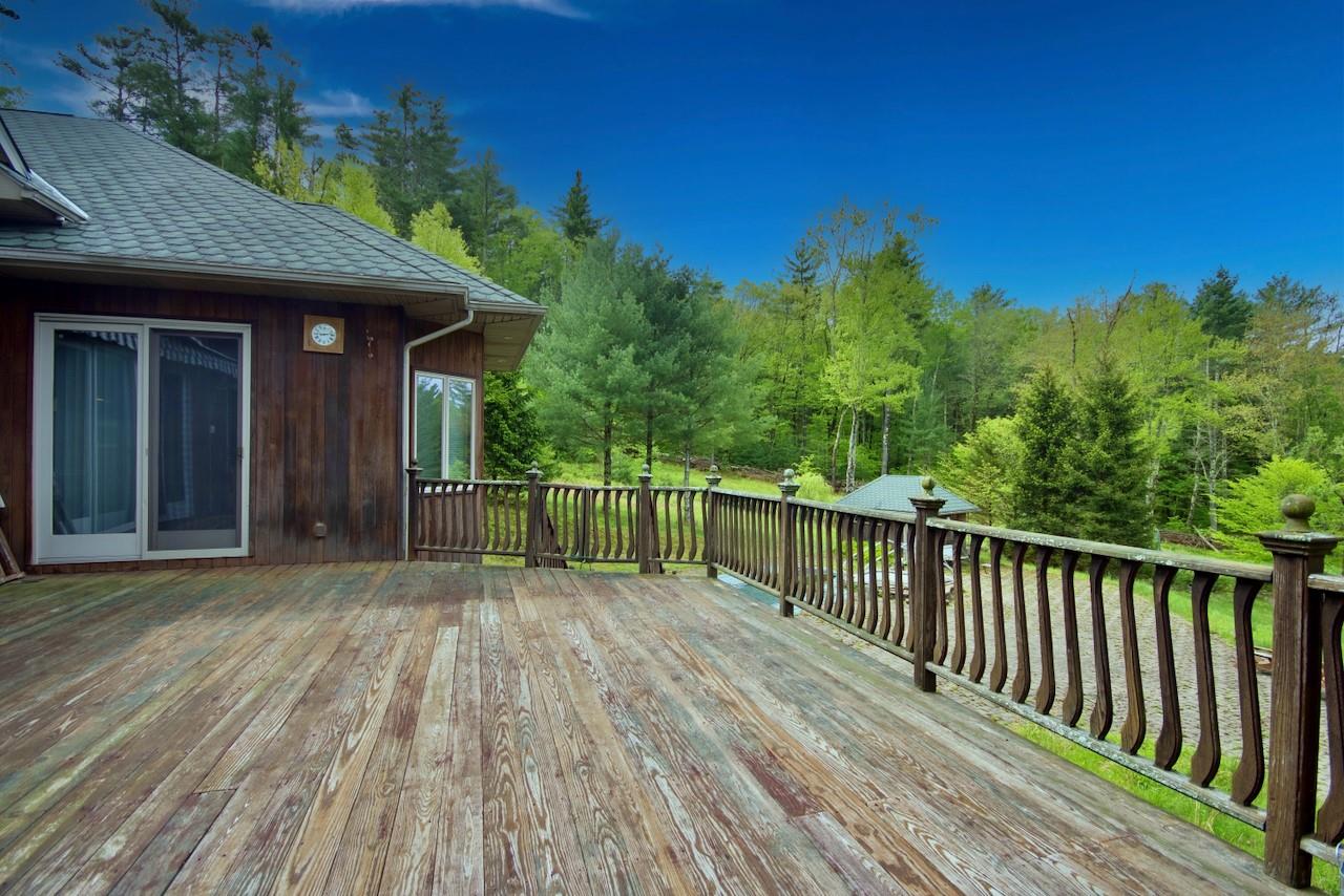 935 Starlight Road Monticello, NY 12701 - Photo 46 of 50 a view of a house with a wooden deck