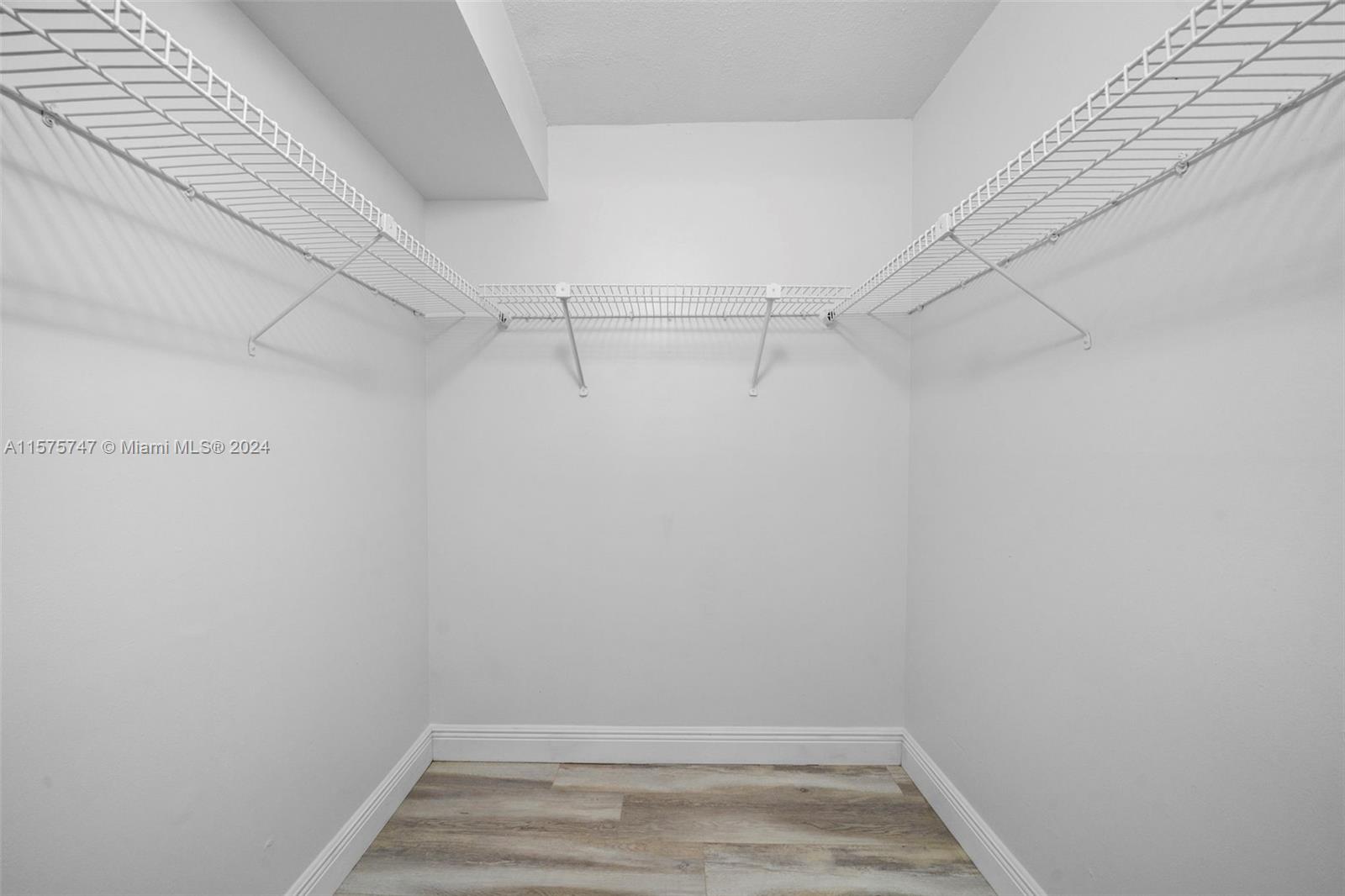 13298 Southwest 112th Terrace, Unit 461 Miami, FL 33186 - Photo 17 of 35 a view of a room with racks on the wall