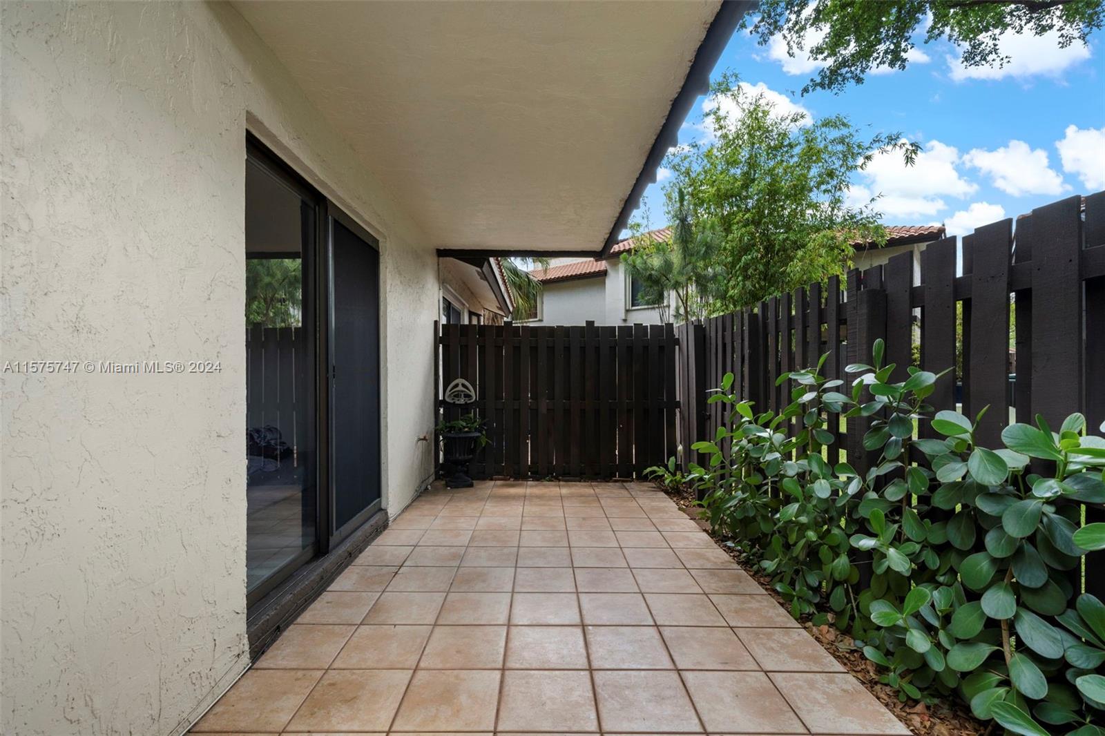 13298 Southwest 112th Terrace, Unit 461 Miami, FL 33186 - Photo 18 of 35 a view of backyard with potted plants