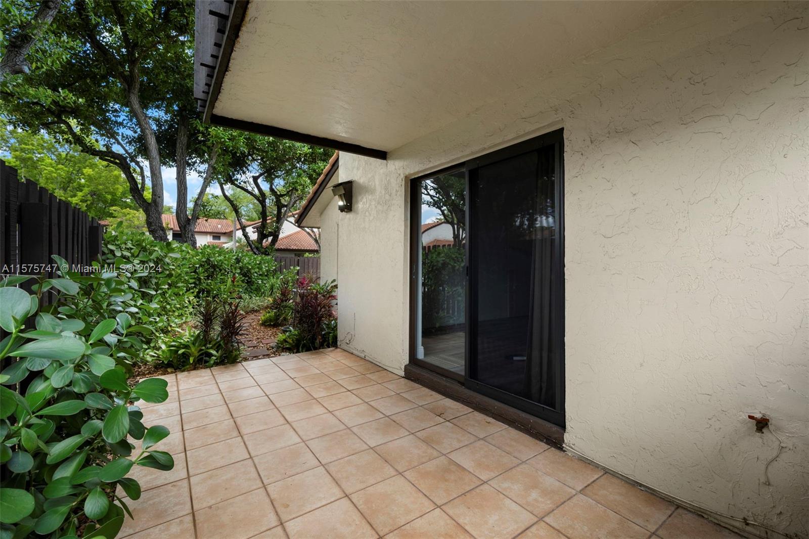 13298 Southwest 112th Terrace, Unit 461 Miami, FL 33186 - Photo 19 of 35 a view of a backyard of the house