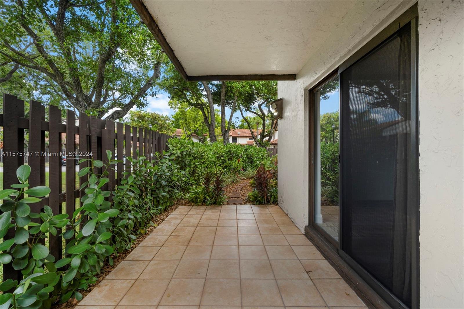 13298 Southwest 112th Terrace, Unit 461 Miami, FL 33186 - Photo 20 of 35 a view of a garden with pathway
