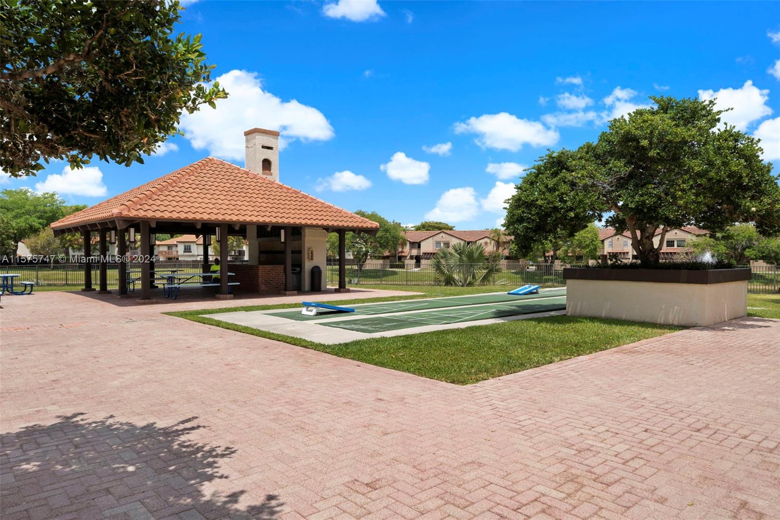 13298 Southwest 112th Terrace, Unit 461 Miami, FL 33186 - Photo 25 of 35 a view of outdoor space yard and patio