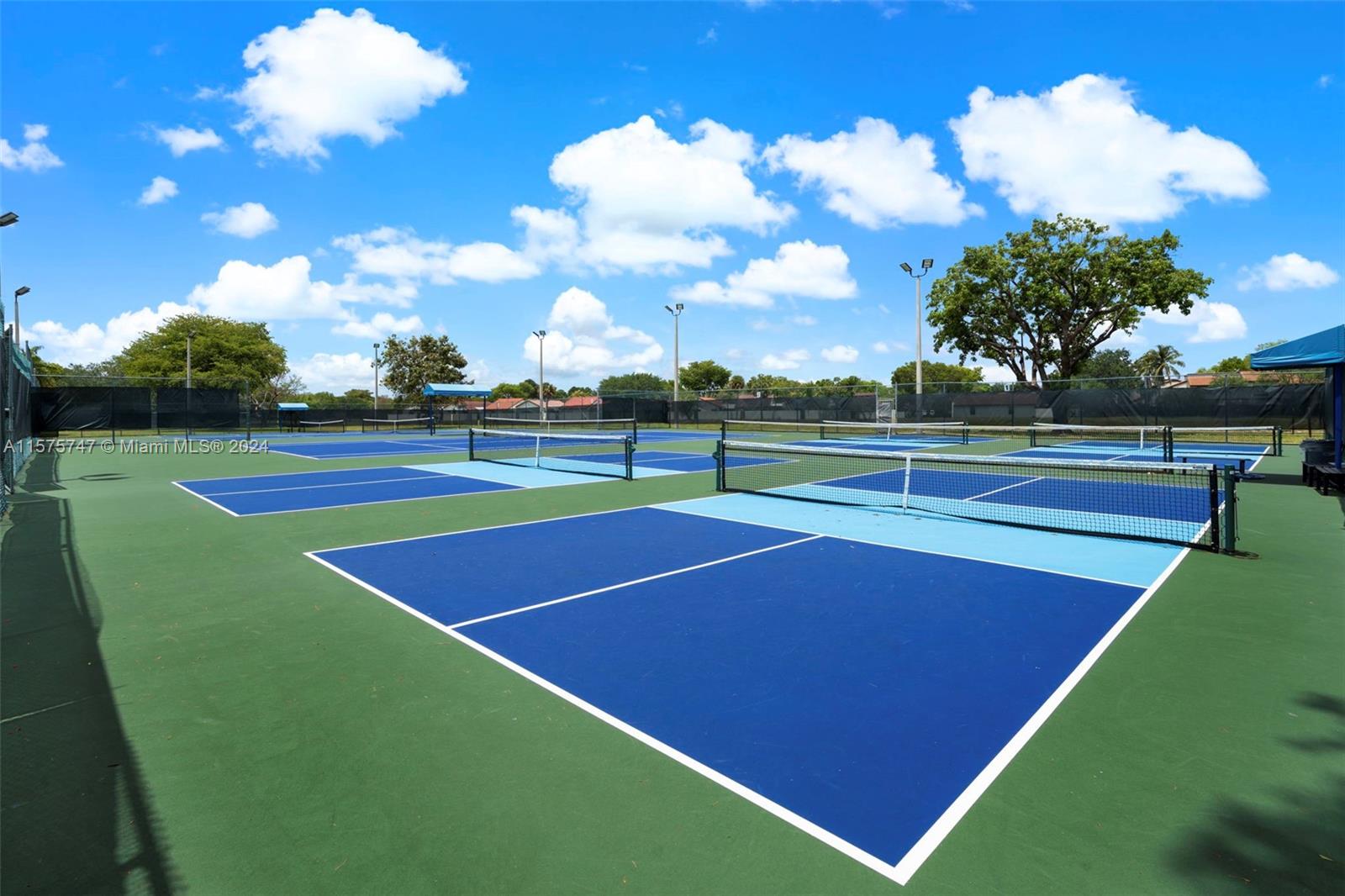 13298 Southwest 112th Terrace, Unit 461 Miami, FL 33186 - Photo 31 of 35 a view of an outdoor space and basketball court