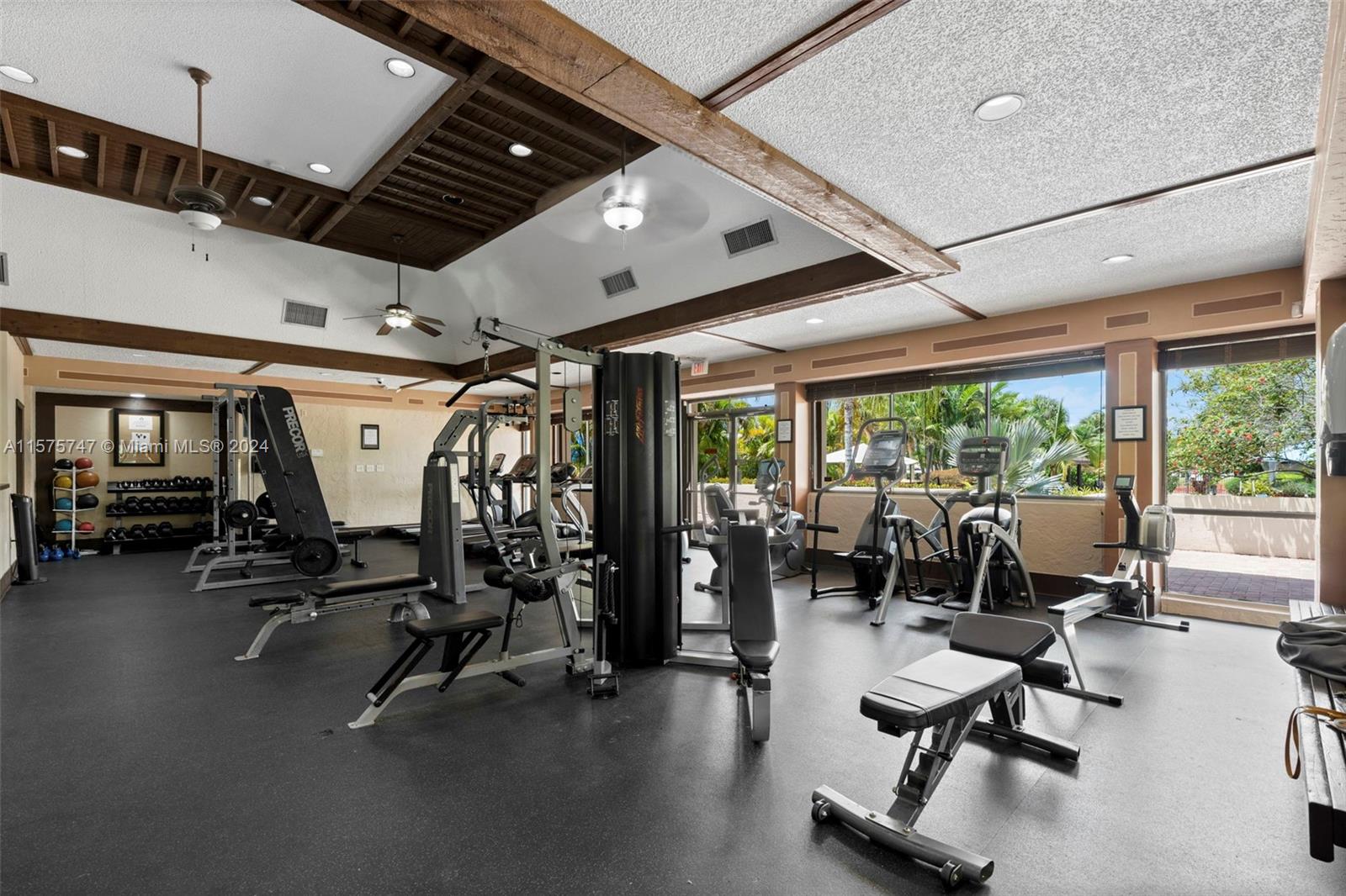 13298 Southwest 112th Terrace, Unit 461 Miami, FL 33186 - Photo 32 of 35 a view of a room with gym equipment