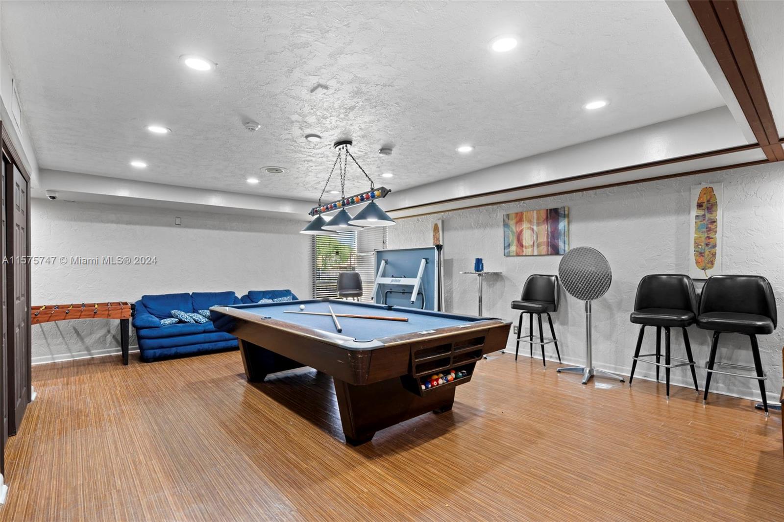 13298 Southwest 112th Terrace, Unit 461 Miami, FL 33186 - Photo 34 of 35 a living room with furniture and wooden floor