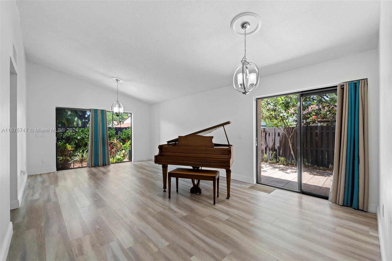 13298 Southwest 112th Terrace, Unit 461 Miami, FL 33186 - Photo 6 of 35 a living room with furniture and a wooden floor