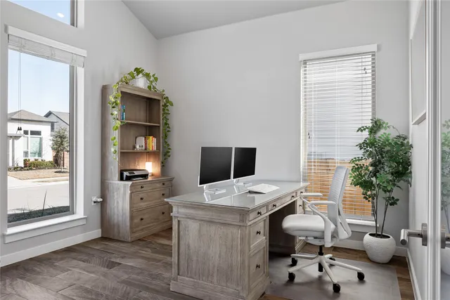 a front view of a house with a yard and a garage
