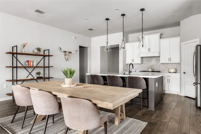 a living room with furniture a flat screen tv and a window