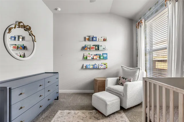 a bedroom with furniture and a window