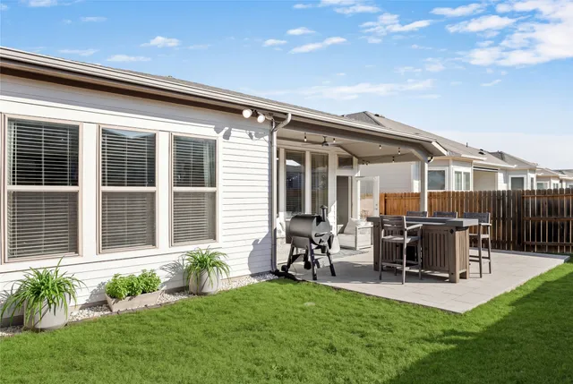 a bathroom with a sink double vanity mirror and a bathtub