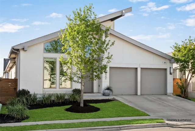 a view of a patio with table and chairs and garden