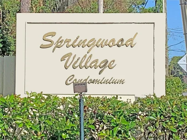 a sign in front of a wall