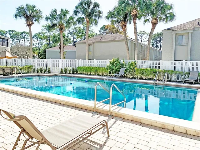 a view of a street with flower plants