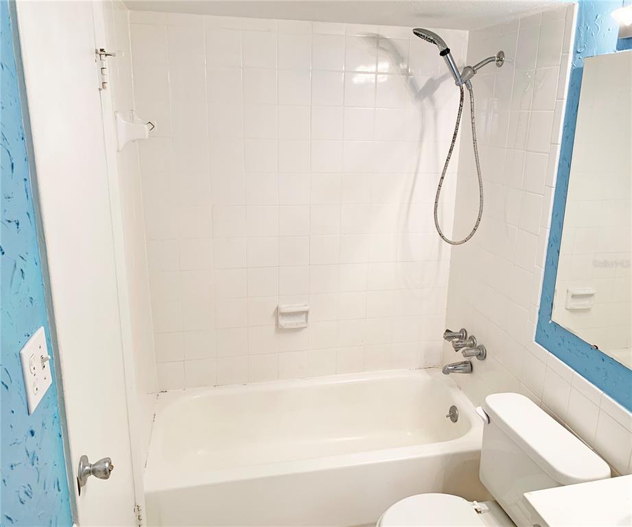 125 Springwood Circle, Unit D Longwood, FL 32750 - Photo 10 of 21 a bathroom with a bath tub with a shower